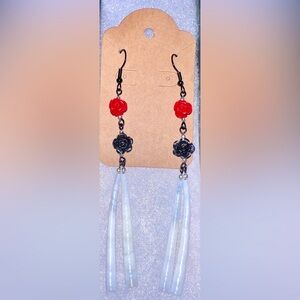 Handmade, detallium shells with black and red roses on black findings! Beautiful